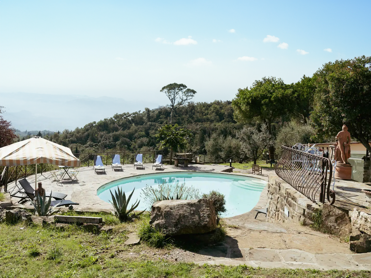 Pool area with panoramic Tuscan hills view