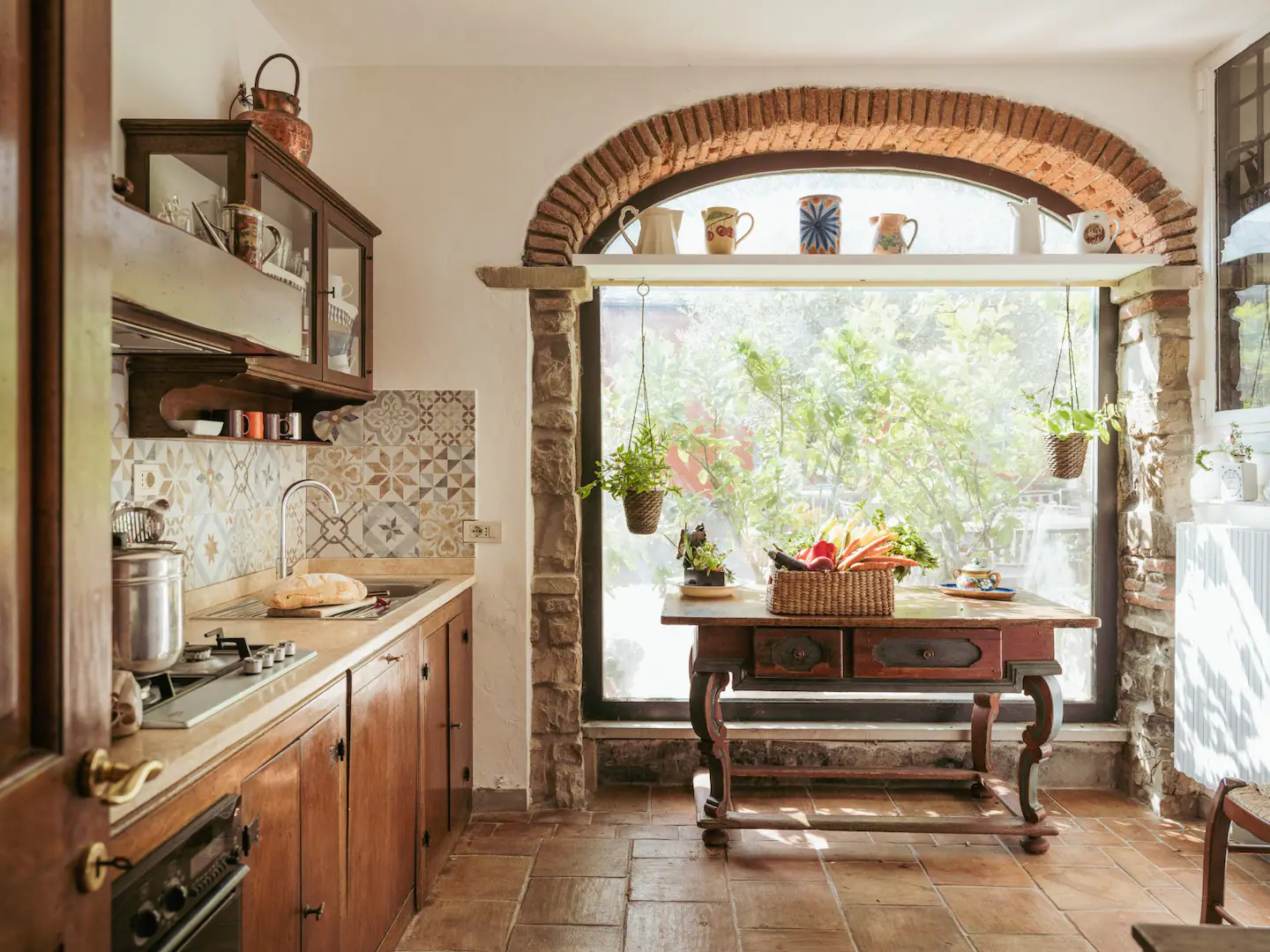 Authentic Tuscan kitchen with brick arch and fresh ingredients